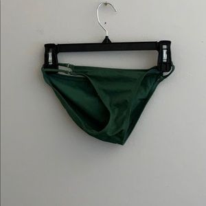 Green swim bottoms with cutout sides